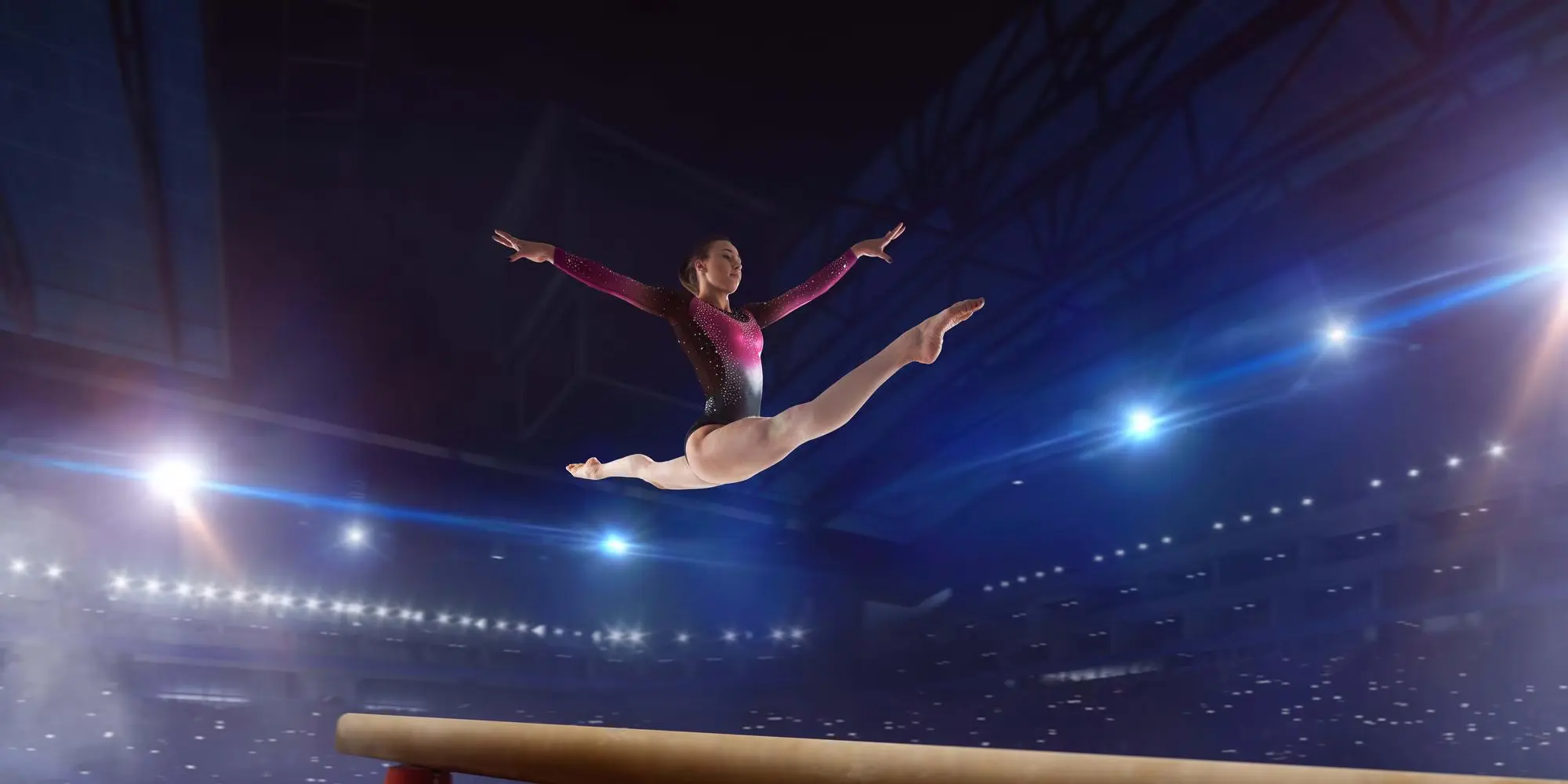 Gymnast performing on balance beam
